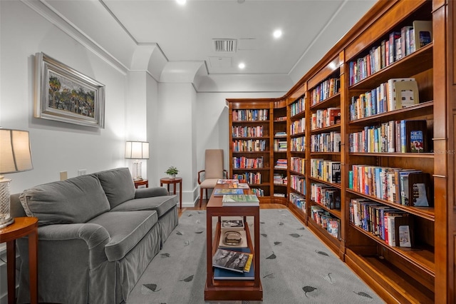 1350 Main St Unit 1703, Sarasota, FL 34236 - sitting room with wall of books and wood finished floors