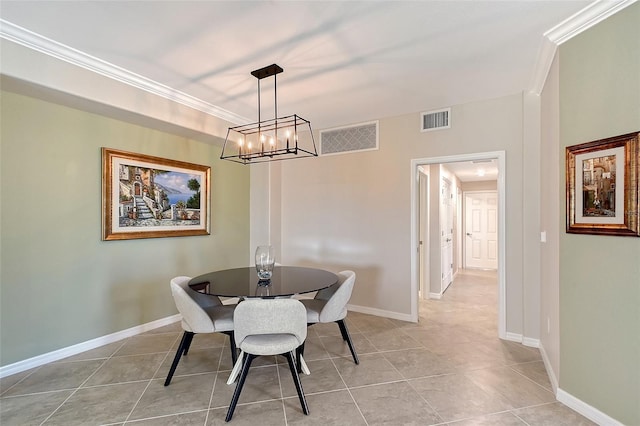 1017 Tidewater Shores Loop Unit 1017, Bradenton, FL 34208 - dining area with light tile patterned floors, a chandelier, crown molding, and baseboards