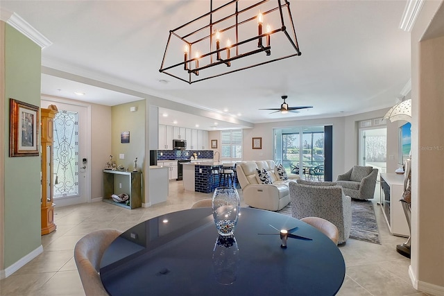 1017 Tidewater Shores Loop Unit 1017, Bradenton, FL 34208 - dining space with crown molding, light tile patterned floors, baseboards, recessed lighting, and ceiling fan