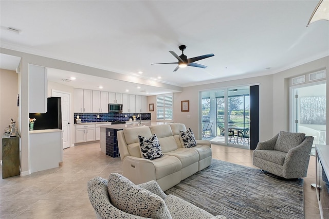 1017 Tidewater Shores Loop Unit 1017, Bradenton, FL 34208 - living room with crown molding, light tile patterned floors, a ceiling fan, and recessed lighting