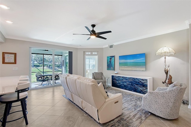 1017 Tidewater Shores Loop Unit 1017, Bradenton, FL 34208 - living room featuring ceiling fan, light tile patterned floors, and crown molding