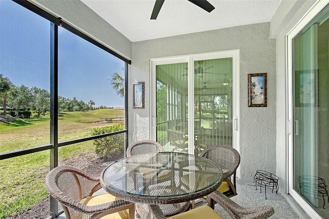 1017 Tidewater Shores Loop Unit 1017, Bradenton, FL 34208 - sunroom / solarium with a ceiling fan and outdoor dining space