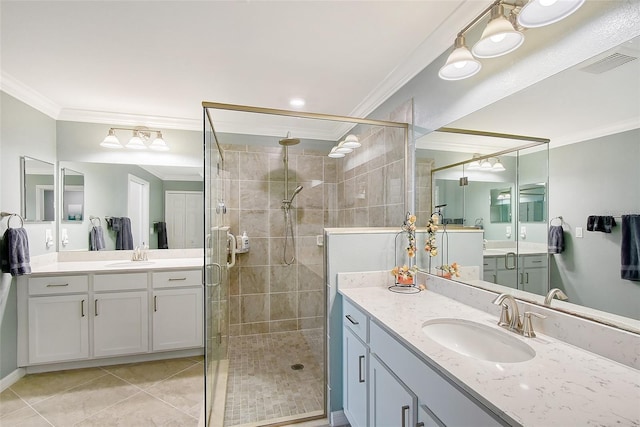 1017 Tidewater Shores Loop Unit 1017, Bradenton, FL 34208 - full bath featuring crown molding, a shower stall, tile patterned floors, and two vanities