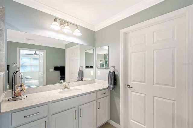 1017 Tidewater Shores Loop Unit 1017, Bradenton, FL 34208 - bathroom with ornamental molding, vanity, and ceiling fan