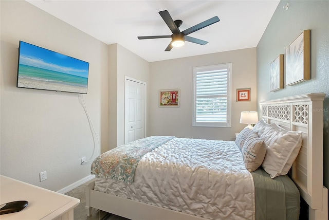 1017 Tidewater Shores Loop Unit 1017, Bradenton, FL 34208 - bedroom with baseboards, carpet floors, ceiling fan, and a closet