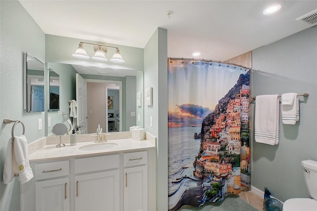 1017 Tidewater Shores Loop Unit 1017, Bradenton, FL 34208 - full bath featuring vanity, toilet, and a shower with shower curtain