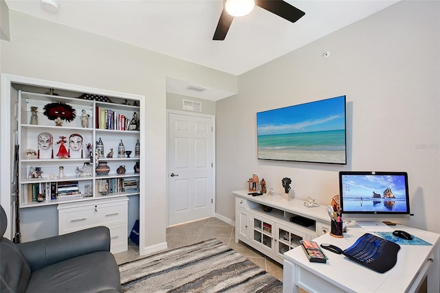 1017 Tidewater Shores Loop Unit 1017, Bradenton, FL 34208 - living area with light tile patterned floors, a ceiling fan, a desk, and baseboards