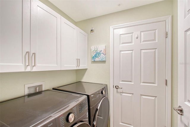 1017 Tidewater Shores Loop Unit 1017, Bradenton, FL 34208 - laundry room with cabinet space and washer and clothes dryer