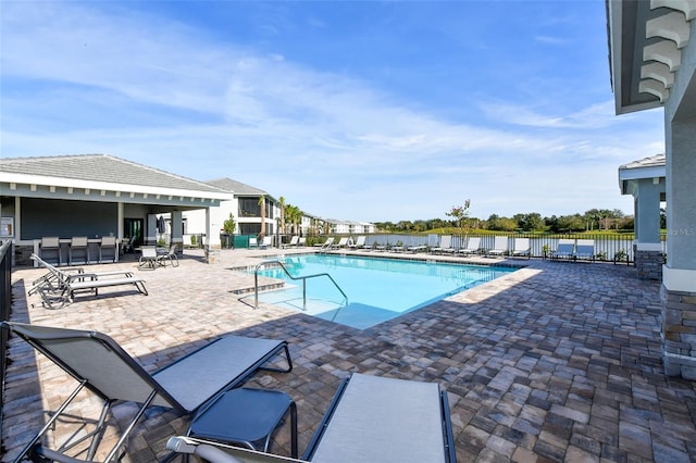 1017 Tidewater Shores Loop Unit 1017, Bradenton, FL 34208 - community pool with a patio and fence