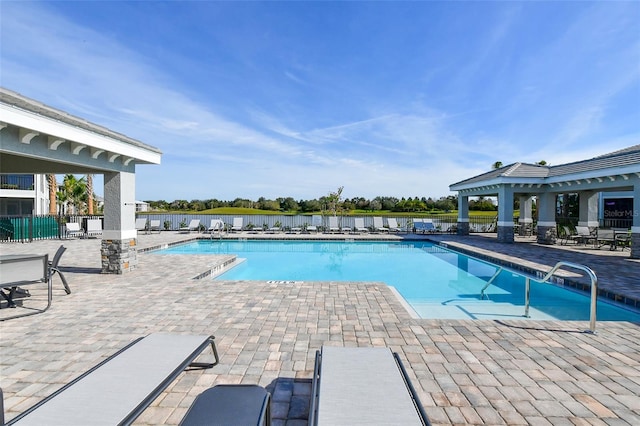 1017 Tidewater Shores Loop Unit 1017, Bradenton, FL 34208 - community pool with a patio and fence