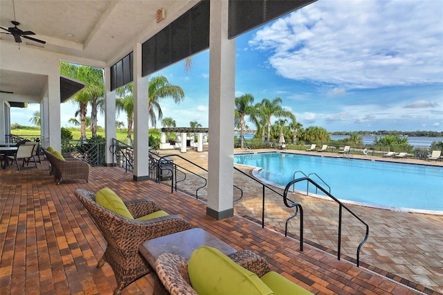 1017 Tidewater Shores Loop Unit 1017, Bradenton, FL 34208 - community pool featuring a ceiling fan and a patio area