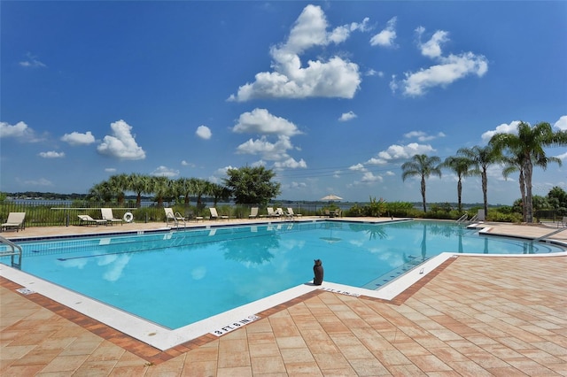 1017 Tidewater Shores Loop Unit 1017, Bradenton, FL 34208 - community pool featuring fence and a patio