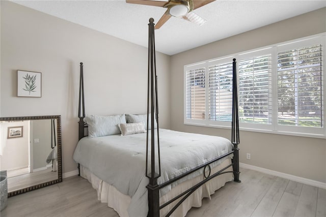 8525 54th Avenue Cir E, Bradenton, FL 34211 - bedroom with multiple windows, light wood-style flooring, and baseboards