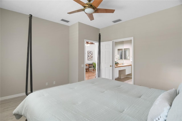 8525 54th Avenue Cir E, Bradenton, FL 34211 - bedroom featuring light wood finished floors, baseboards, ceiling fan, and ensuite bath