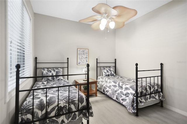 8525 54th Avenue Cir E, Bradenton, FL 34211 - bedroom with light wood-style flooring, baseboards, and a ceiling fan