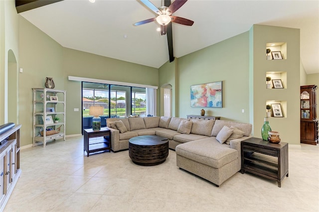 518 Chantilly Trl, Bradenton, FL 34212 - living area featuring high vaulted ceiling, arched walkways, ceiling fan, baseboards, and light tile patterned flooring