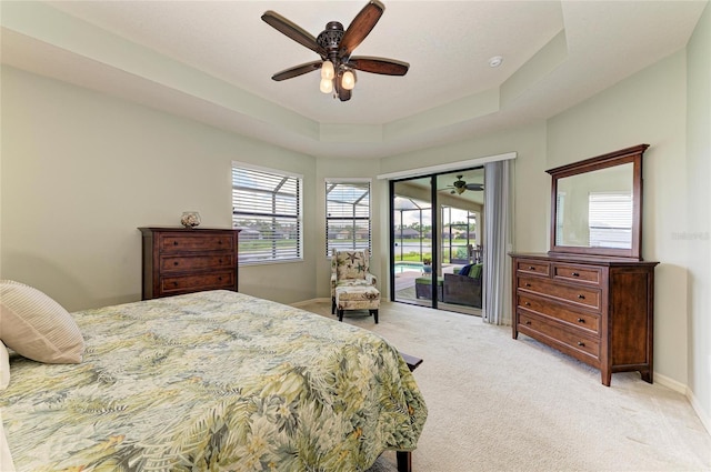 518 Chantilly Trl, Bradenton, FL 34212 - bedroom with access to exterior, light colored carpet, baseboards, and a ceiling fan