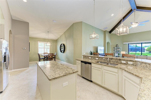 518 Chantilly Trl, Bradenton, FL 34212 - kitchen with stainless steel appliances, a sink, ceiling fan, arched walkways, and light stone countertops