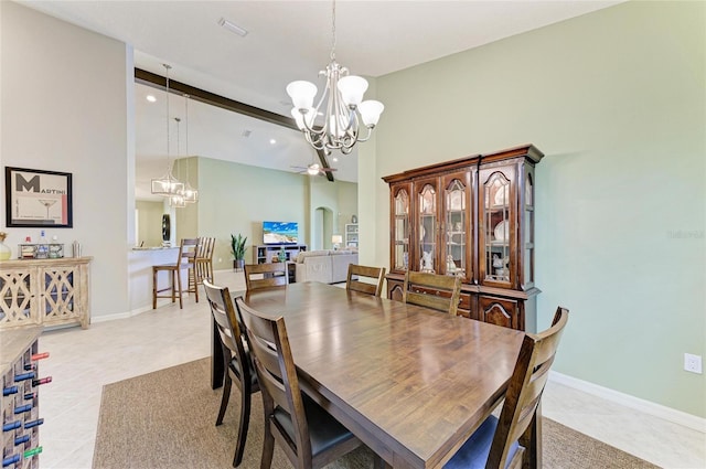 518 Chantilly Trl, Bradenton, FL 34212 - dining space featuring a chandelier, light tile patterned floors, baseboards, a high ceiling, and recessed lighting