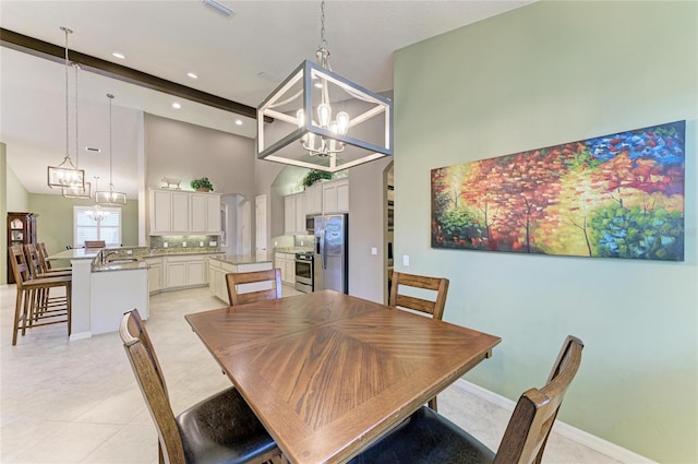 518 Chantilly Trl, Bradenton, FL 34212 - dining area with a chandelier, a high ceiling, recessed lighting, and baseboards