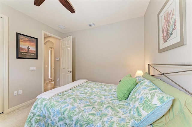 518 Chantilly Trl, Bradenton, FL 34212 - carpeted bedroom with arched walkways, baseboards, and a ceiling fan