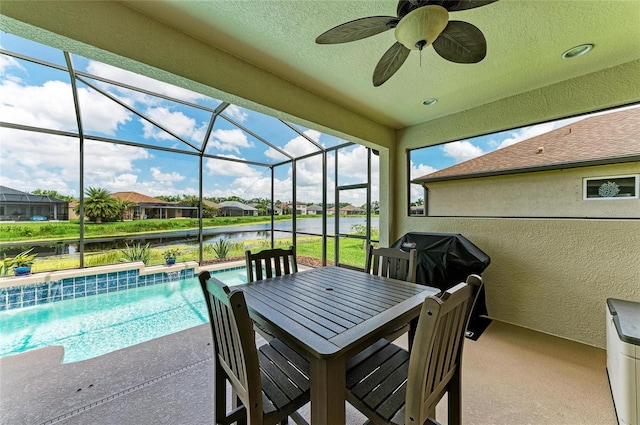 518 Chantilly Trl, Bradenton, FL 34212 - view of patio with a water view, ceiling fan, an outdoor pool, glass enclosure, and a residential view