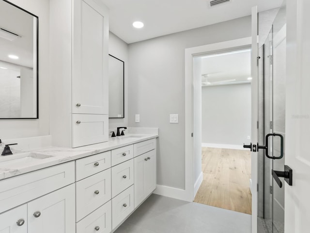 180 Lookout Point Dr, Osprey, FL 34229 - full bath featuring double vanity, a stall shower, and recessed lighting