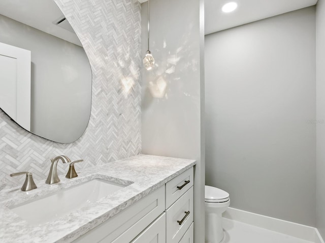180 Lookout Point Dr, Osprey, FL 34229 - bathroom featuring vanity, decorative backsplash, and recessed lighting