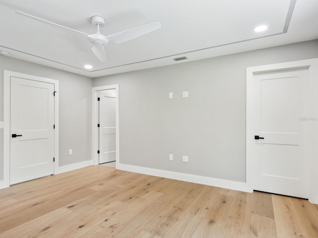 180 Lookout Point Dr, Osprey, FL 34229 - unfurnished bedroom featuring light wood-style flooring, recessed lighting, and a ceiling fan