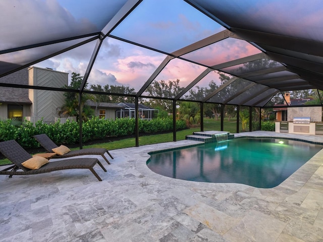 180 Lookout Point Dr, Osprey, FL 34229 - outdoor pool with exterior kitchen, a patio, a lanai, and a lawn