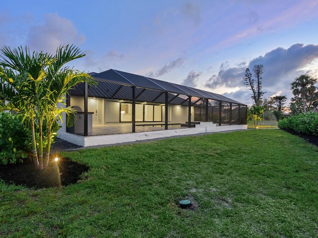 180 Lookout Point Dr, Osprey, FL 34229 - rear view of house featuring a yard and a lanai