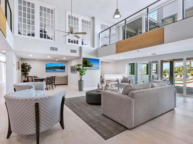 180 Lookout Point Dr, Osprey, FL 34229 - living room with a towering ceiling and a ceiling fan
