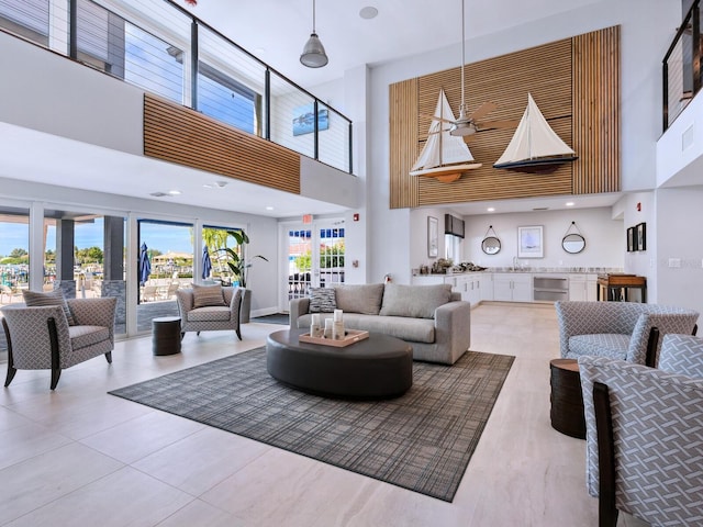 180 Lookout Point Dr, Osprey, FL 34229 - living room featuring a high ceiling