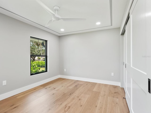 180 Lookout Point Dr, Osprey, FL 34229 - unfurnished bedroom featuring recessed lighting, a closet, light wood finished floors, and a ceiling fan