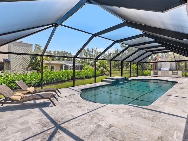 180 Lookout Point Dr, Osprey, FL 34229 - outdoor pool featuring exterior kitchen, a patio, and a lanai