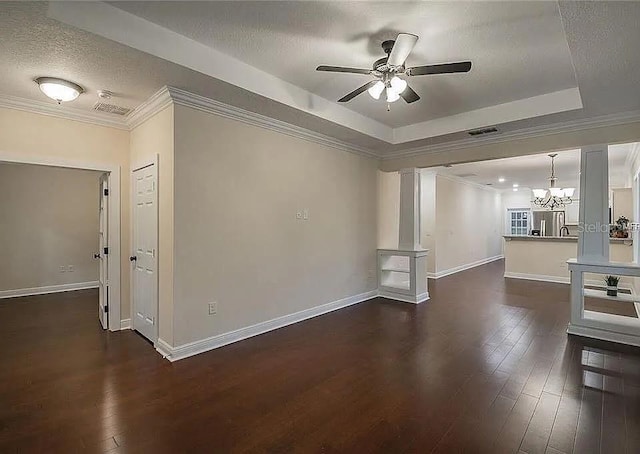 1420 E Frierson Ave, Tampa, FL 33603 - unfurnished living room with a chandelier, a ceiling fan, a textured ceiling, dark wood-style floors, and baseboards