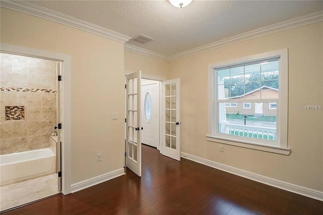 1420 E Frierson Ave, Tampa, FL 33603 - unfurnished room featuring crown molding, hardwood / wood-style floors, french doors, baseboards, and a textured ceiling