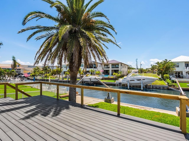 7779 Holiday Dr N, Sarasota, FL 34231 - wooden deck featuring a water view, a dock, and a residential view