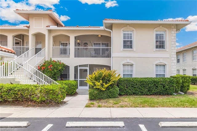 10202 L Pavia Blvd Unit 10202, Venice, FL 34292 - view of property with uncovered parking and stairway