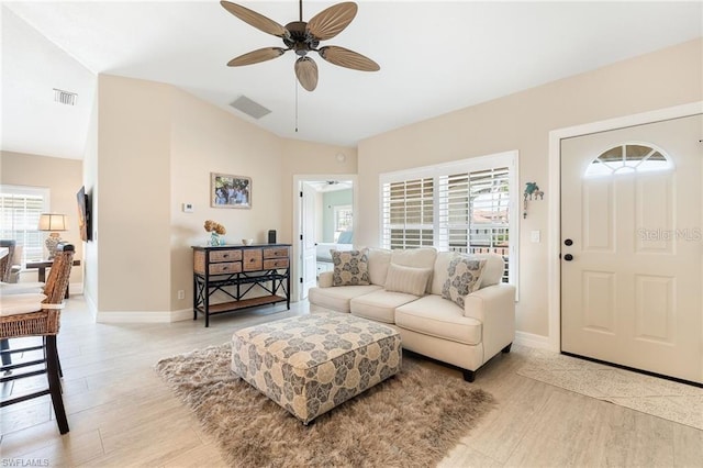 10202 L Pavia Blvd Unit 10202, Venice, FL 34292 - living area featuring ceiling fan, light wood-style floors, baseboards, and vaulted ceiling