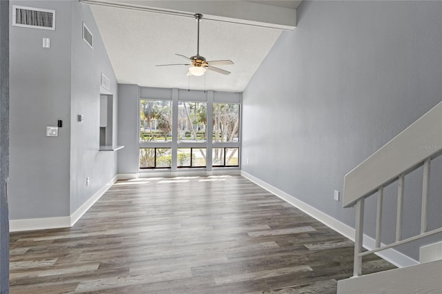 800 S Blvd Of The Presidents Unit 5, Sarasota, FL 34236 - unfurnished living room with a ceiling fan, wood finished floors, baseboards, high vaulted ceiling, and beam ceiling