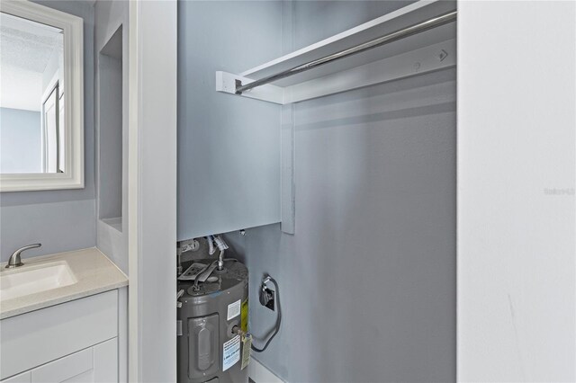 800 S Blvd Of The Presidents Unit 5, Sarasota, FL 34236 - interior space with a sink and water heater