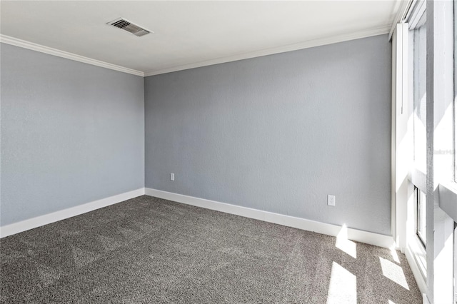 800 S Blvd Of The Presidents Unit 5, Sarasota, FL 34236 - spare room with crown molding, dark colored carpet, and baseboards