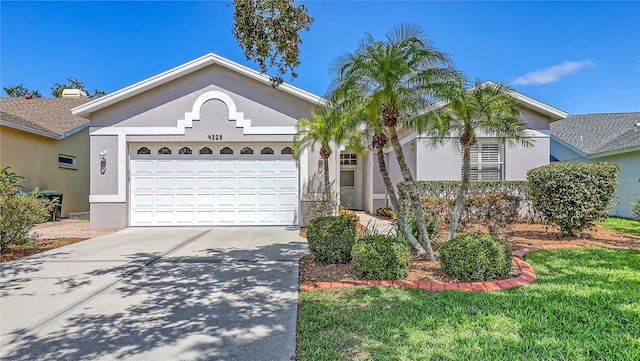 4208 Balmoral Way, Sarasota, FL 34238 - ranch-style home featuring an attached garage, stucco siding, and driveway