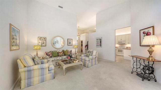 4208 Balmoral Way, Sarasota, FL 34238 - living room with a high ceiling and light colored carpet