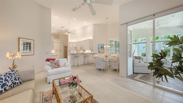 4208 Balmoral Way, Sarasota, FL 34238 - living room featuring ceiling fan, light tile patterned floors, a high ceiling, and recessed lighting