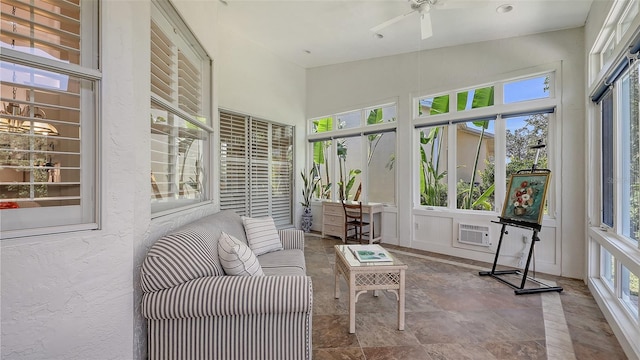 4208 Balmoral Way, Sarasota, FL 34238 - sunroom with a ceiling fan, an outdoor living space, stone finish flooring, a wall mounted AC, and a high ceiling