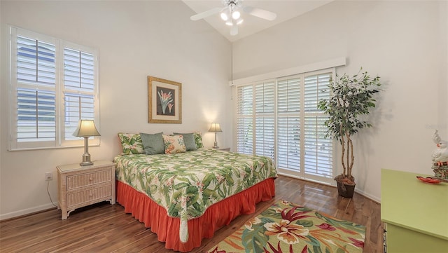 4208 Balmoral Way, Sarasota, FL 34238 - bedroom featuring multiple windows, baseboards, wood finished floors, high vaulted ceiling, and a ceiling fan