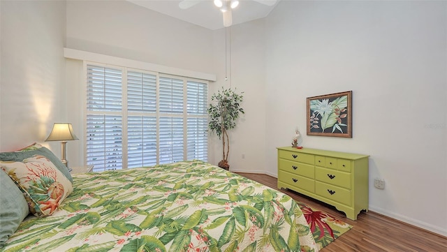 4208 Balmoral Way, Sarasota, FL 34238 - bedroom featuring wood finished floors, baseboards, and a towering ceiling