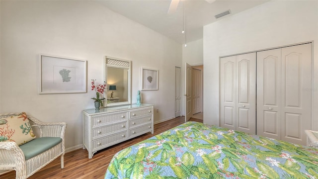 4208 Balmoral Way, Sarasota, FL 34238 - bedroom with wood finished floors, a high ceiling, a closet, and baseboards